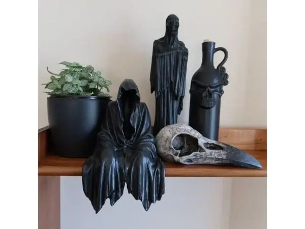 A STATUE OF A SITTING GHOST