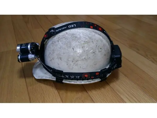 Headlight holder for helmet