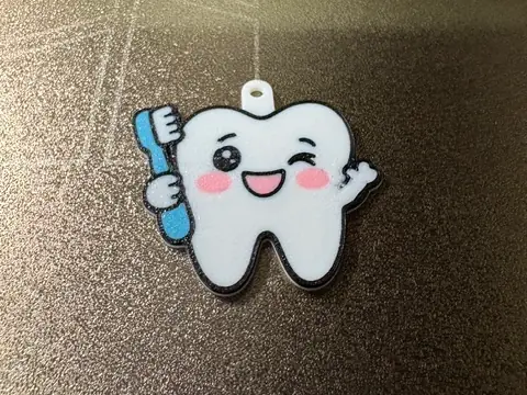 Porte clé dent avec sa brosse