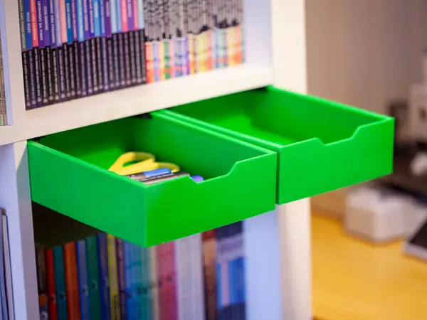 The drawer under the bookshelf