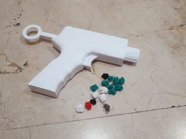 Pistola lanza purgas / pelotas