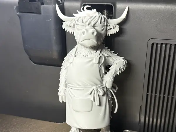 Grumpy Highland Cow in Apron