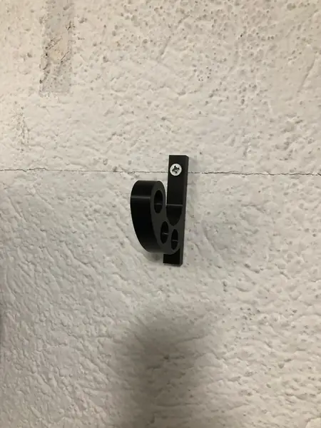 Wall mounted motorcycle helmet holder