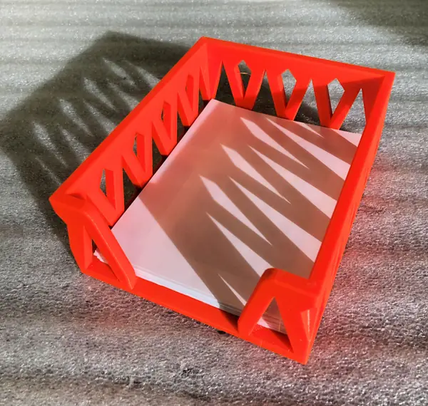 A decorative tray to hold note paper