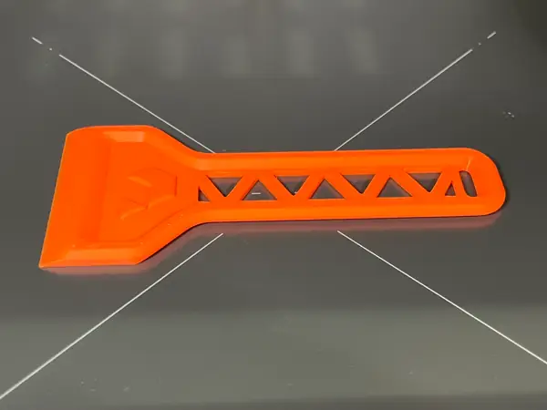 Prusa Spatula Remix + nozzle wiping on underside. Printbed scraper.